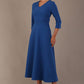  Model wearing the Nova V-neck A-line midaxi dress in vibrant imperial blue