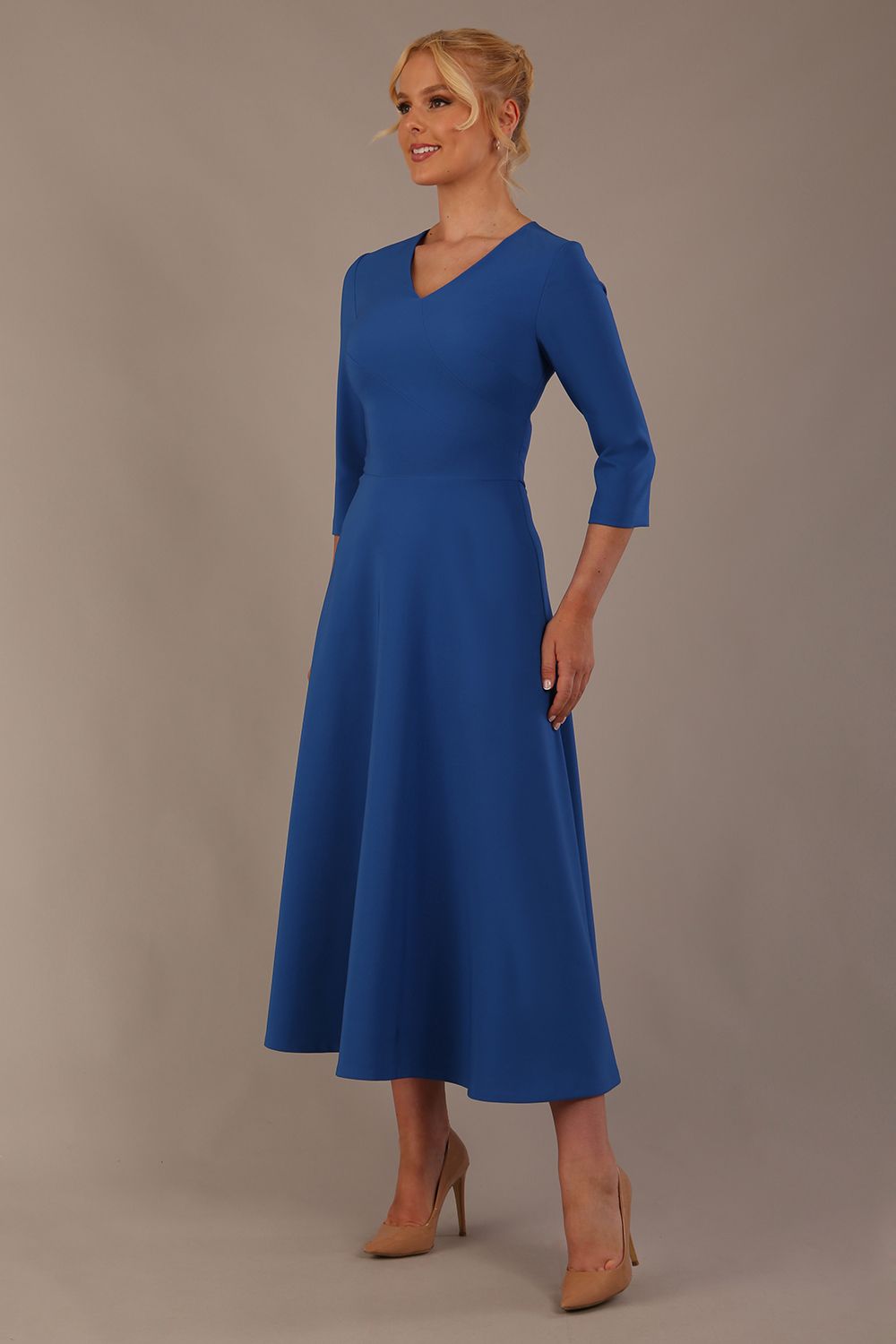  Model wearing the Nova V-neck A-line midaxi dress in vibrant imperial blue