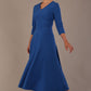  Model wearing the Nova V-neck A-line midaxi dress in vibrant imperial blue