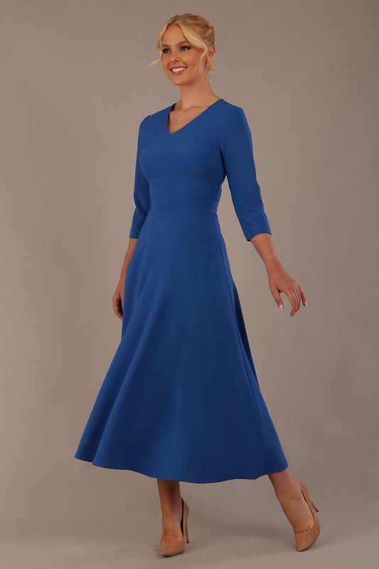  Model wearing the Nova V-neck A-line midaxi dress in vibrant imperial blue