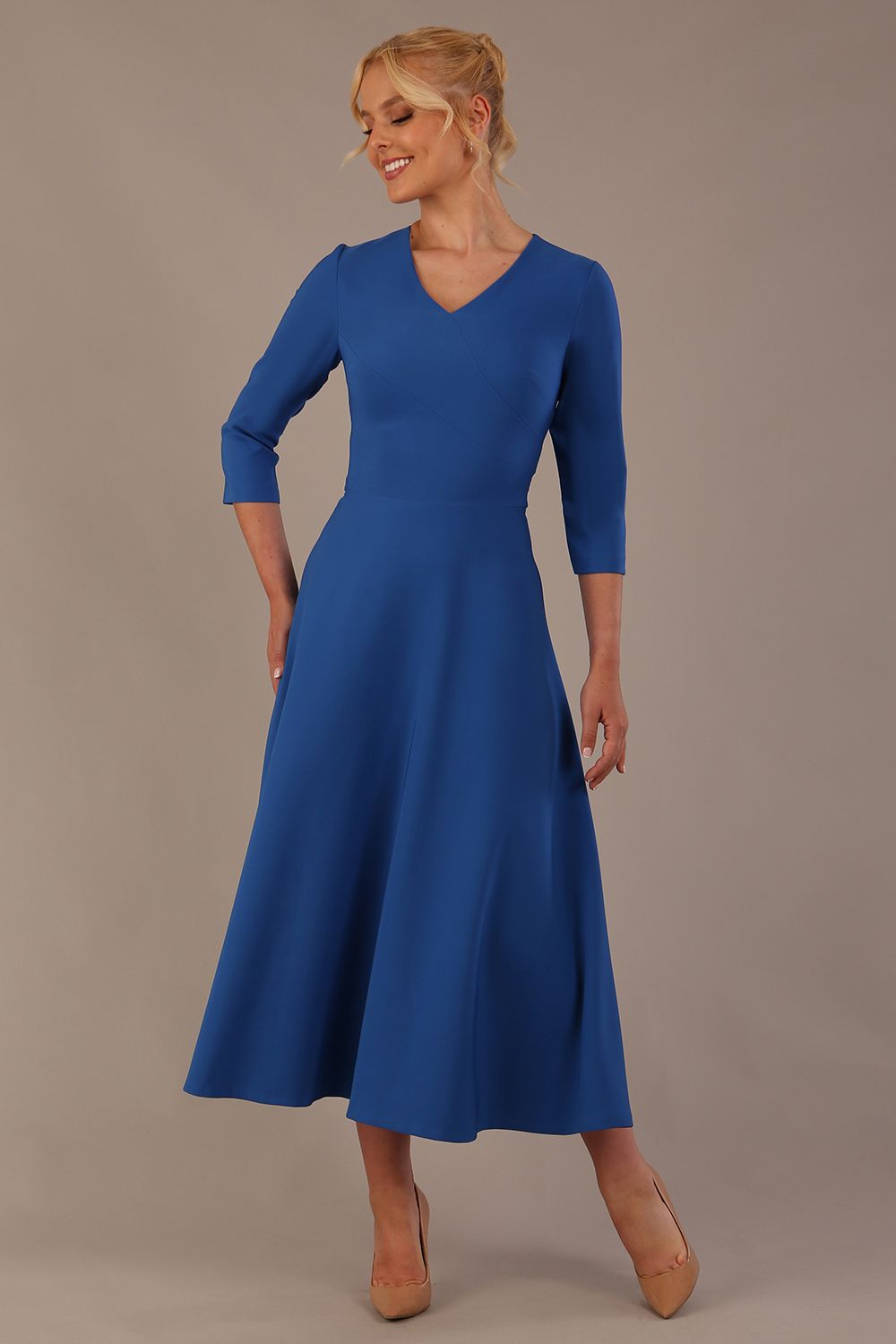  Model wearing the Nova V-neck A-line midaxi dress in vibrant imperial blue
