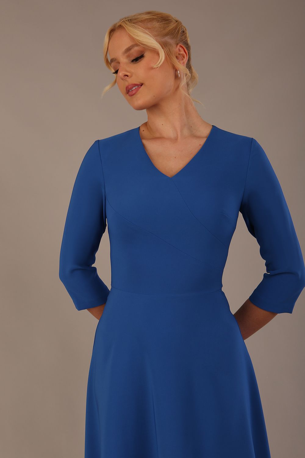  Model wearing the Nova V-neck A-line midaxi dress in vibrant imperial blue close up
