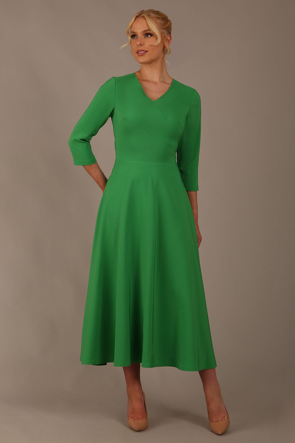  Model wearing the Nova V-neck A-line midaxi dress in vibrant jelly bean green