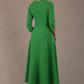  Model wearing the Nova V-neck A-line midaxi dress in vibrant jelly bean green back view
