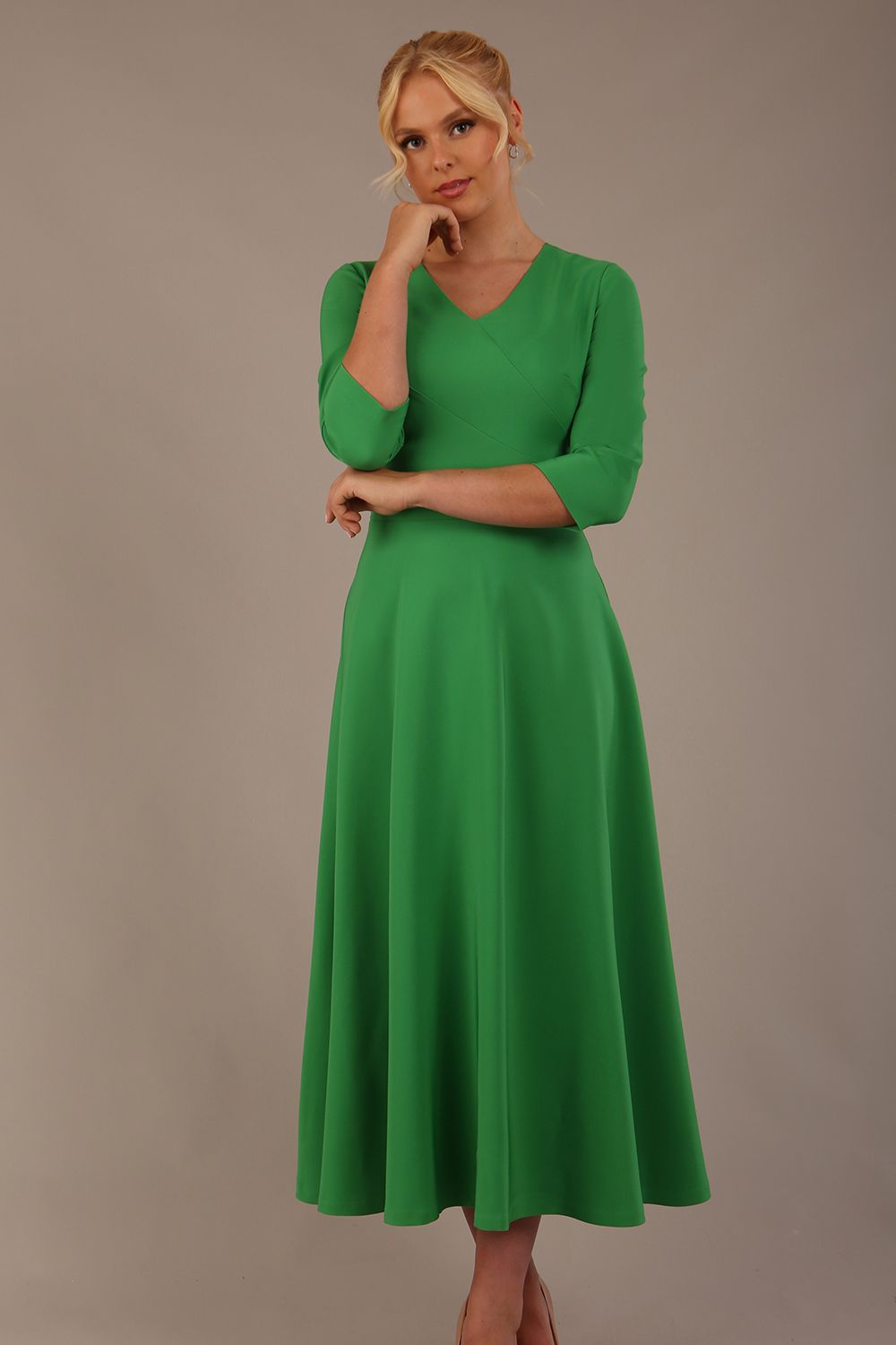  Model wearing the Nova V-neck A-line midaxi dress in vibrant jelly bean green