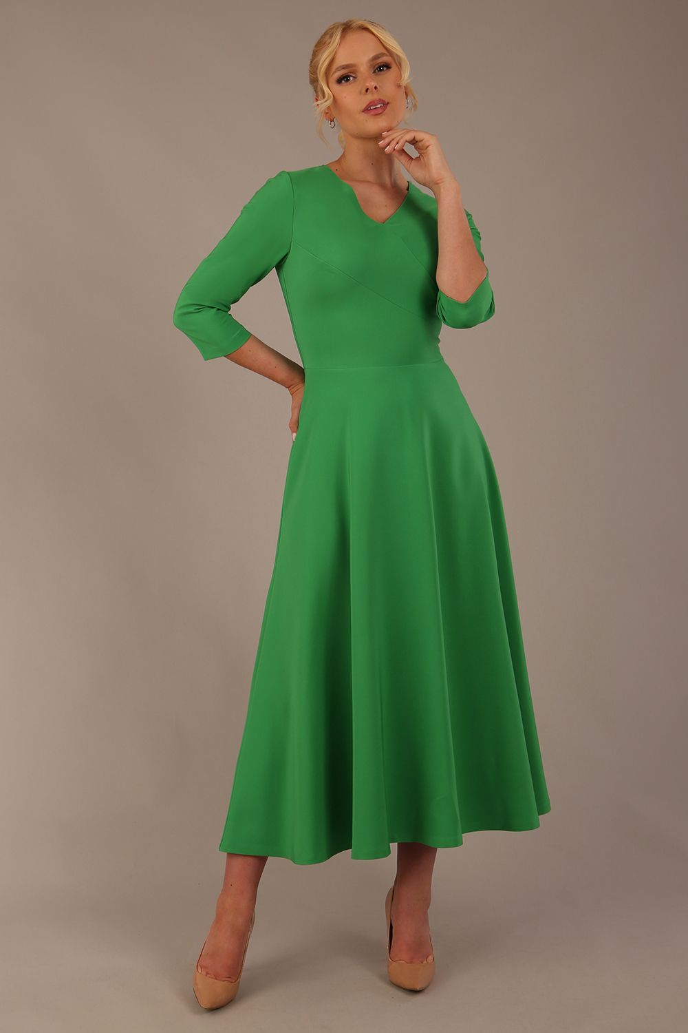  Model wearing the Nova V-neck A-line midaxi dress in vibrant jelly bean green
