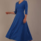 Woman wearing a blue dress against a plain background (Imperial Blue)