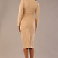 Model wearing the Cassidy cowl neck pencil dress in cafe au lait cream back view