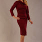 Woman wearing The Cassidy cowl neck dress in rich claret red, showing the ruched waist detail, against a plain background