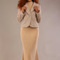 Model wearing the Teddy Luxe Boucle Jacket in pink tint, styled over a cream pencil dress close up (Pink Tint)