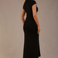 Model wearing the Kaden high neck midaxi dress in jet black, showing the sleek silhouette and cap sleeves against a plain background back view
