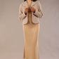 Woman wearing a beige outfit with a textured jacket and the Kaden high neck midaxi dress in cafe au lait cream, showing the sleek silhouette and cap sleeves against a plain background 