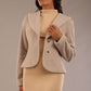 Model wearing the Teddy Luxe Boucle Jacket in pink tint, styled over a cream pencil dress close up (Pink Tint)