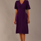 Model wearing the Dale pleated A-line dress against a plain background (Purple)