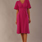 Model wearing the Dale pleated A-line dress against a plain background (Magenta)