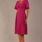 Model wearing the Dale pleated A-line dress against a plain background (Magenta)