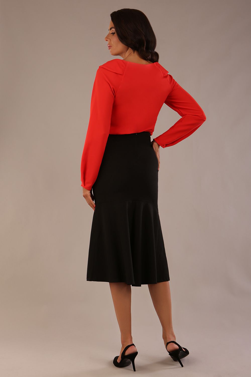 Back view of the black Marlene fishtail skirt, showing the flared silhouette and concealed zip.