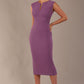 Model wearing the Wesley notched pencil dress in Purple heart, showcasing the sculpted silhouette and V-notch neckline