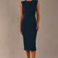 Model wearing the Wesley notched pencil dress in teal, showcasing the sculpted silhouette and V-notch neckline.