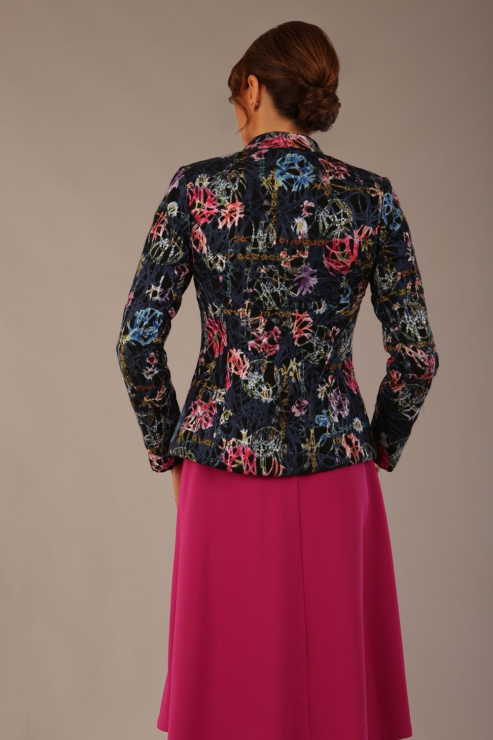 The Keanu floral jacket layered over a pink A-line dress for an elegant occasion look, back view (Nightshade Bloom)