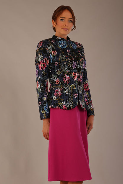 The Keanu floral jacket layered over a pink A-line dress for an elegant occasion look, side view (Nightshade Bloom)
