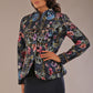 Model wearing the Keanu high-neck floral jacquard jacket styled with a navy pencil skirt (Nightshade Bloom)