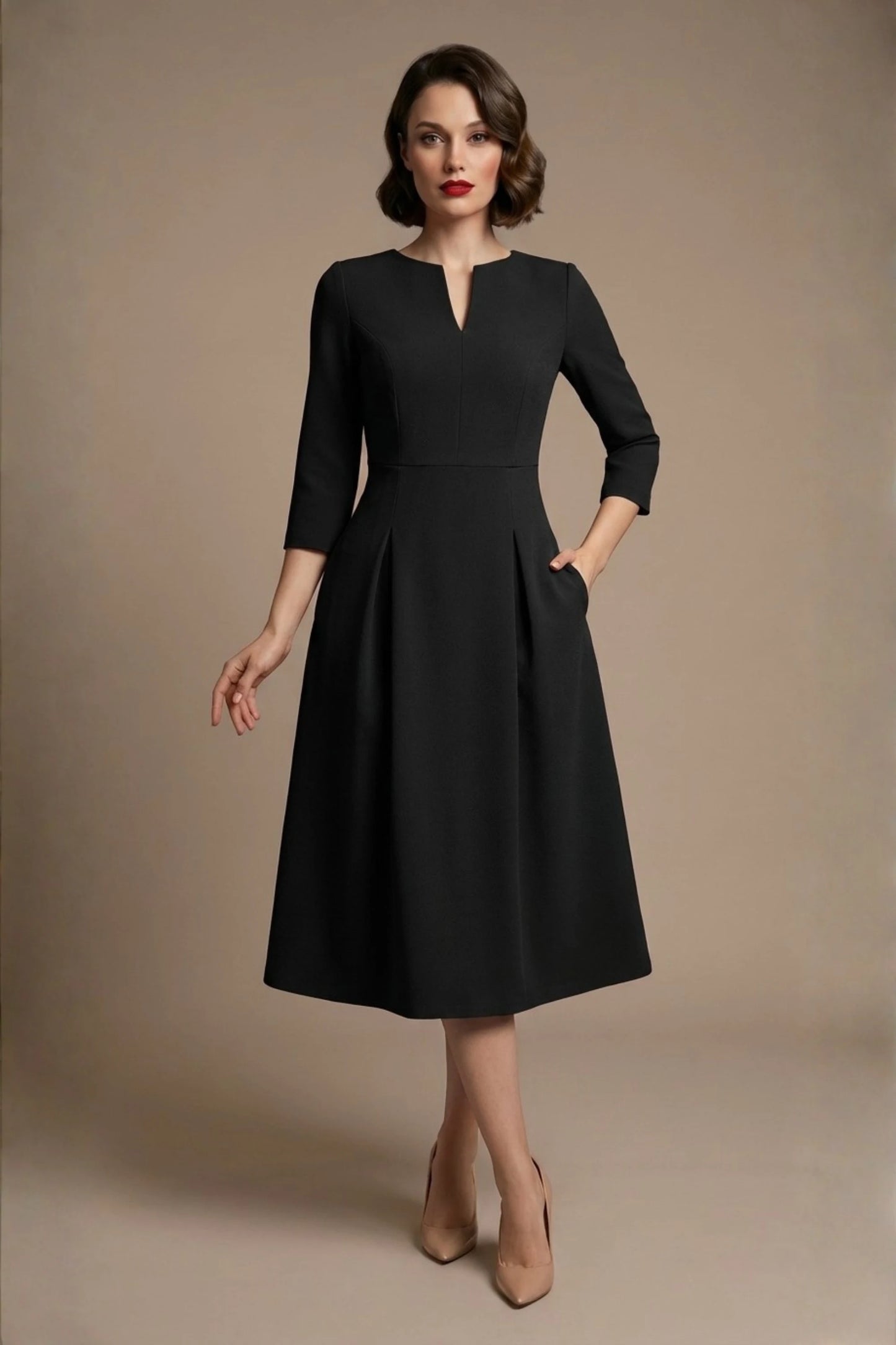 Woman wearing a diva catwalk Amanda Pleated a-line dress in a magenta pink colour against a beige background (Black)