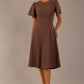 Model wearing a diva catwalk Anders petal sleeve A-line dress against a plain background (Peppercorn Brown)
