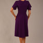 back view Model wearing a diva catwalk Anders petal sleeve A-line dress against a plain background (Purple)