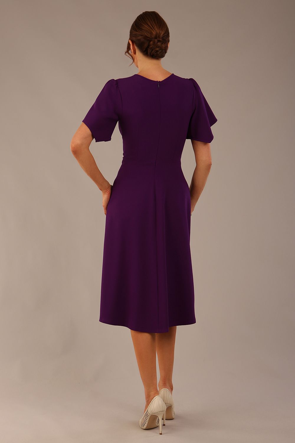 back view Model wearing a diva catwalk Anders petal sleeve A-line dress against a plain background (Purple)