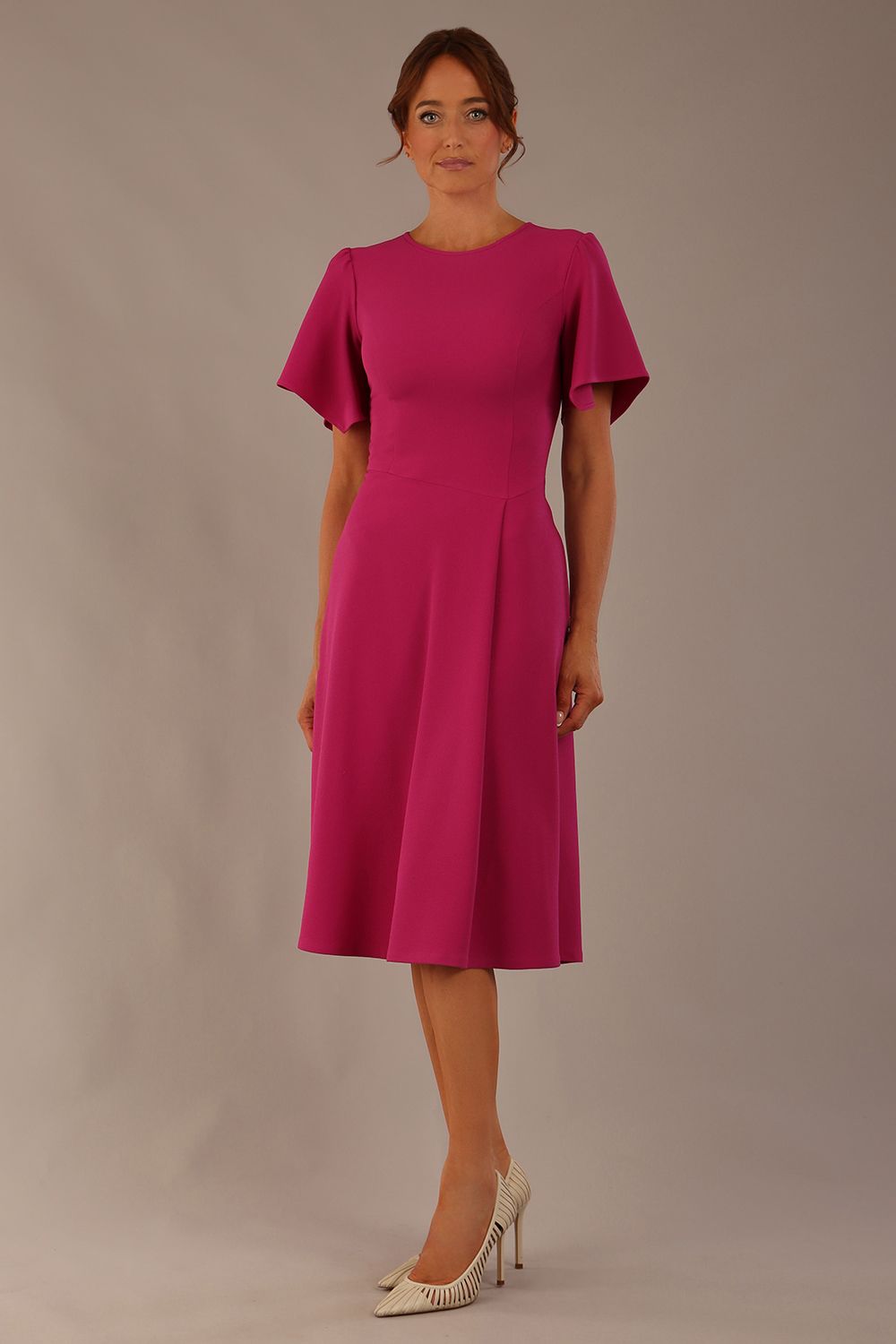 Model wearing a diva catwalk Anders petal sleeve A-line dress against a plain background (Magenta)