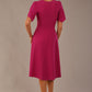 back view Model wearing a diva catwalk Anders petal sleeve A-line dress against a plain background (Magenta)