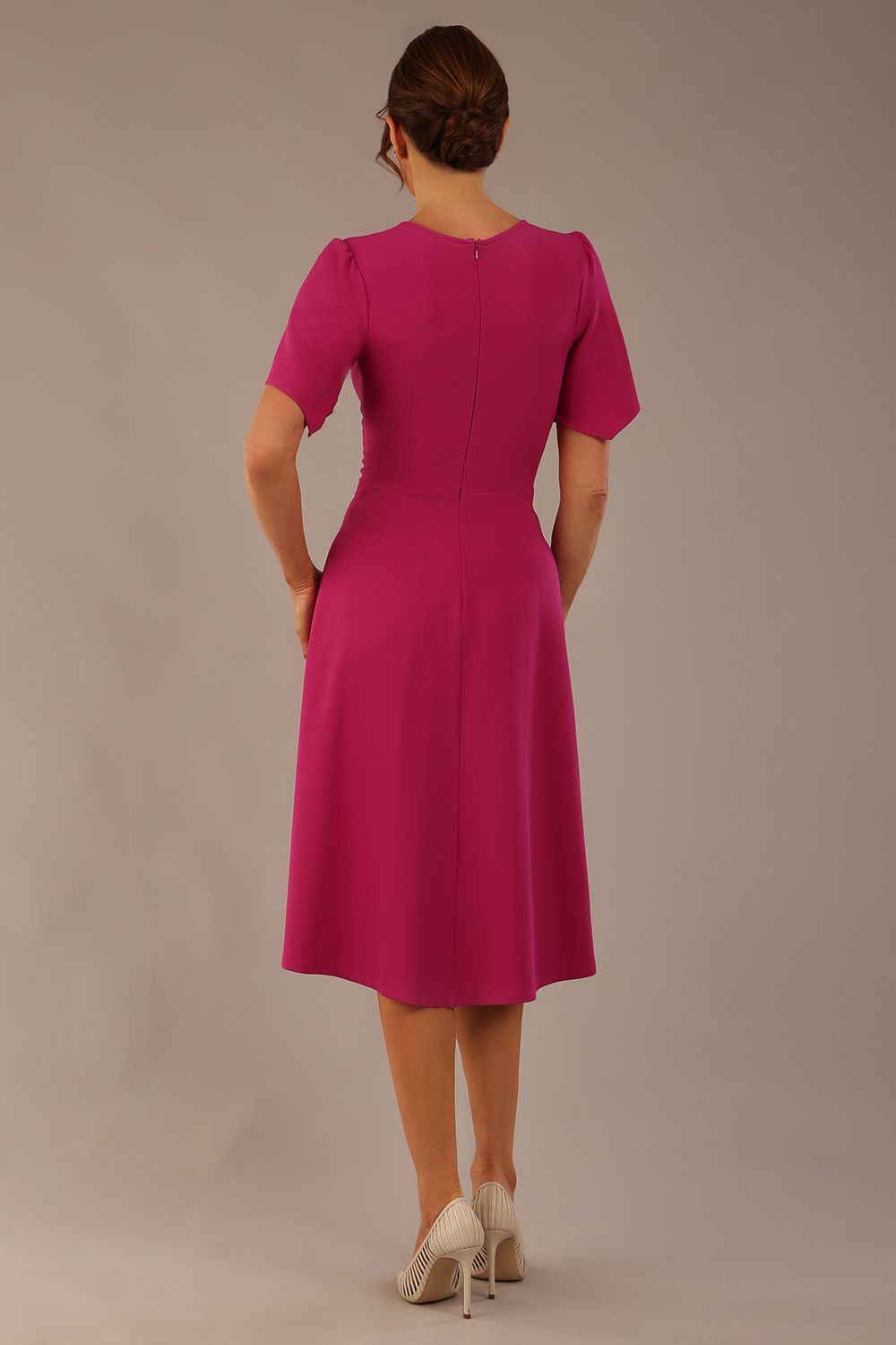 back view Model wearing a diva catwalk Anders petal sleeve A-line dress against a plain background (Magenta)