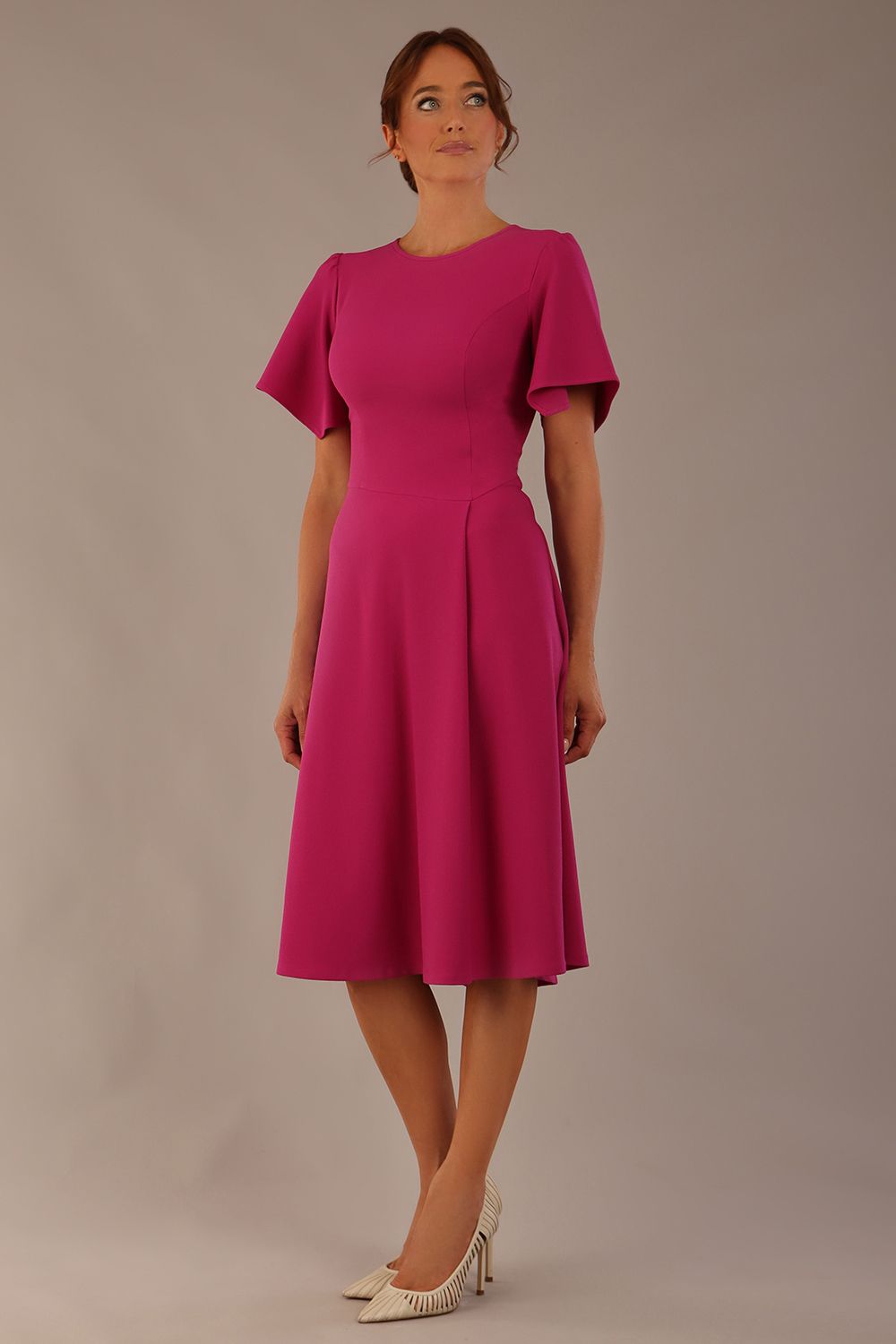 Model wearing a diva catwalk Anders petal sleeve A-line dress against a plain background (Magenta)