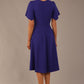 back view Model wearing a diva catwalk Anders petal sleeve A-line dress against a plain background (Spectrum Indigo)
