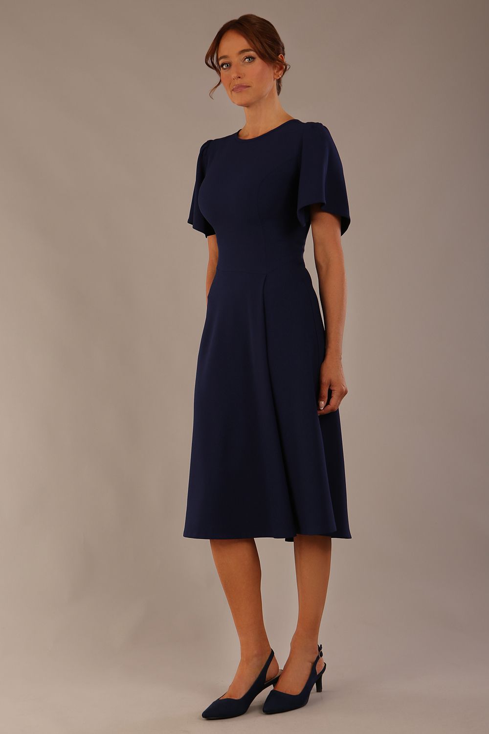 Model wearing a diva catwalk Anders petal sleeve A-line dress against a plain background (Navy Blue)