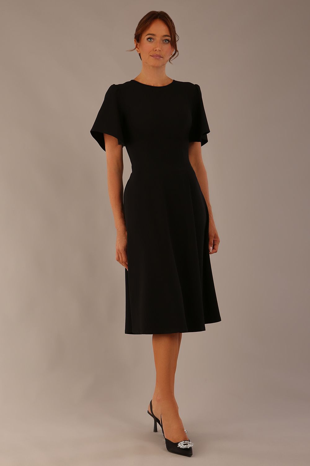 Model wearing a diva catwalk Anders petal sleeve A-line dress against a plain background (Black)