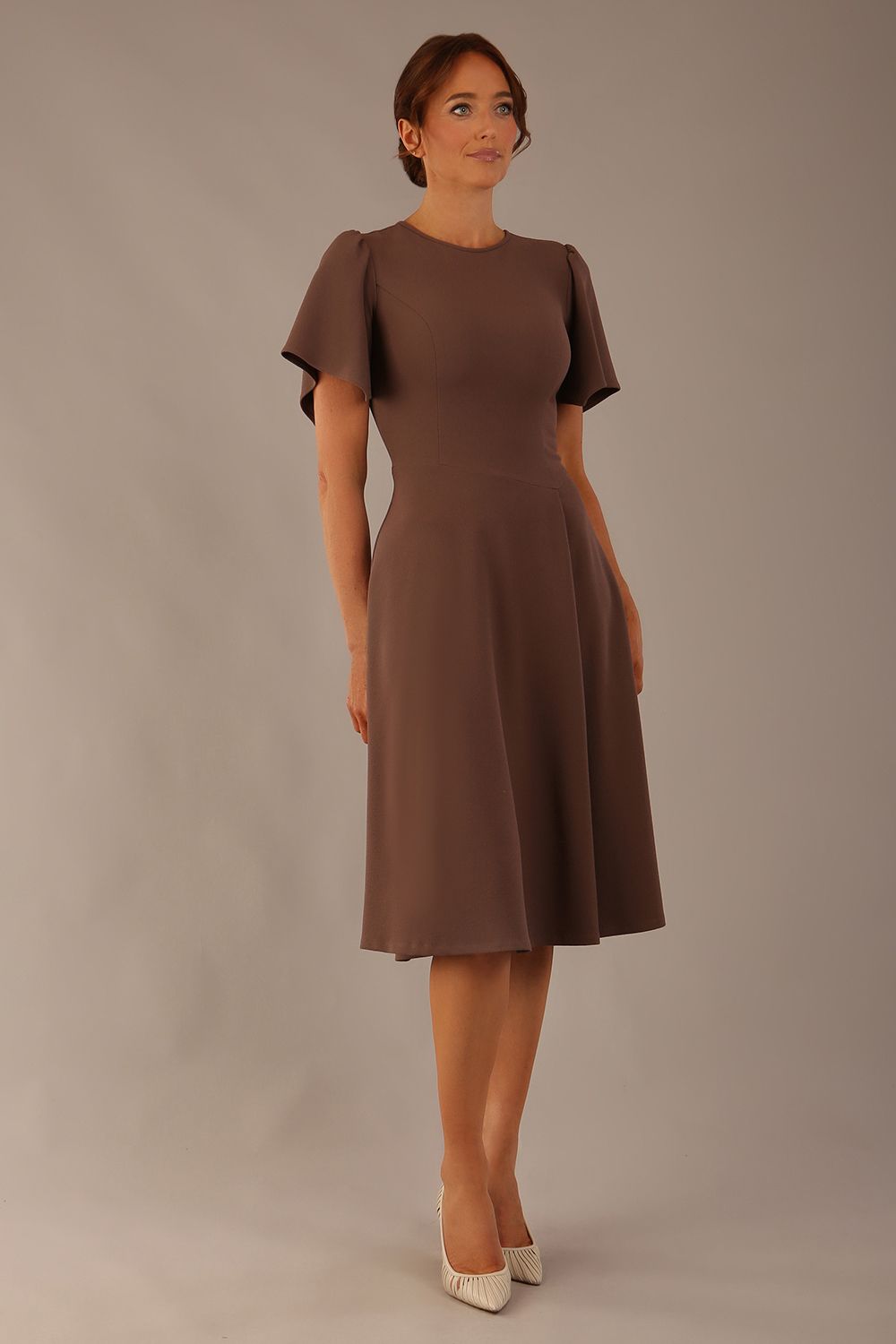 Model wearing a diva catwalk Anders petal sleeve A-line dress against a plain background (Peppercorn Brown)