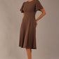 side view Model wearing a diva catwalk Anders petal sleeve A-line dress against a plain background (Peppercorn Brown)