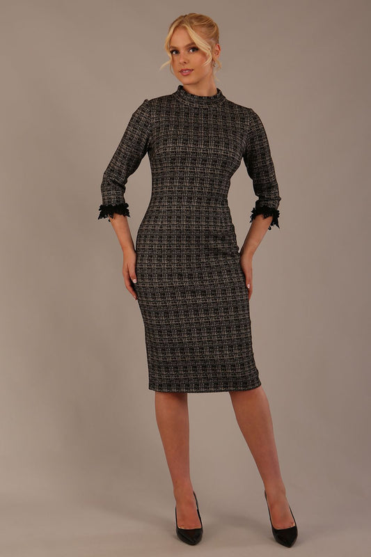 Model wearing the Sterling Cooper lace cuff tweed pencil dress against a plain background