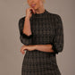 Model wearing the Sterling Cooper lace cuff tweed pencil dress close up (mix print)