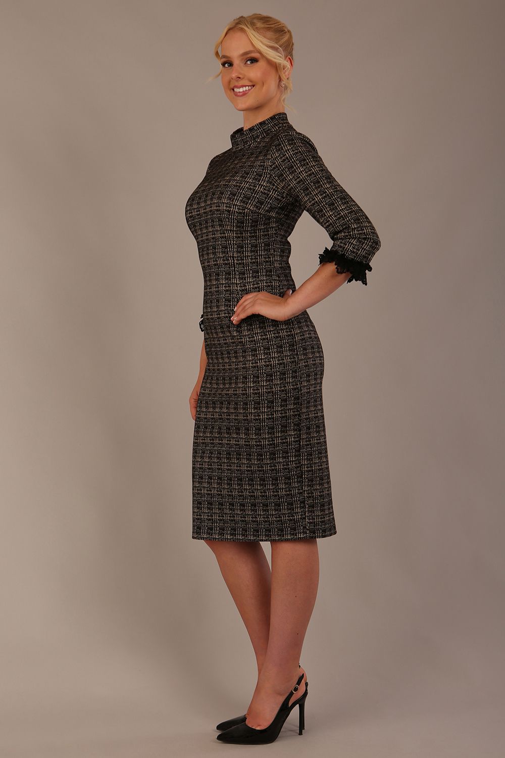 Model wearing the Sterling Cooper lace cuff tweed pencil dress side view