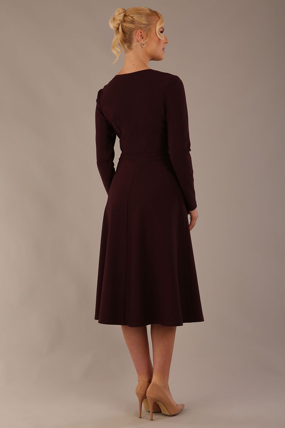 Back view of the Moneypenny long-sleeved A-line dress, showing the clean silhouette.