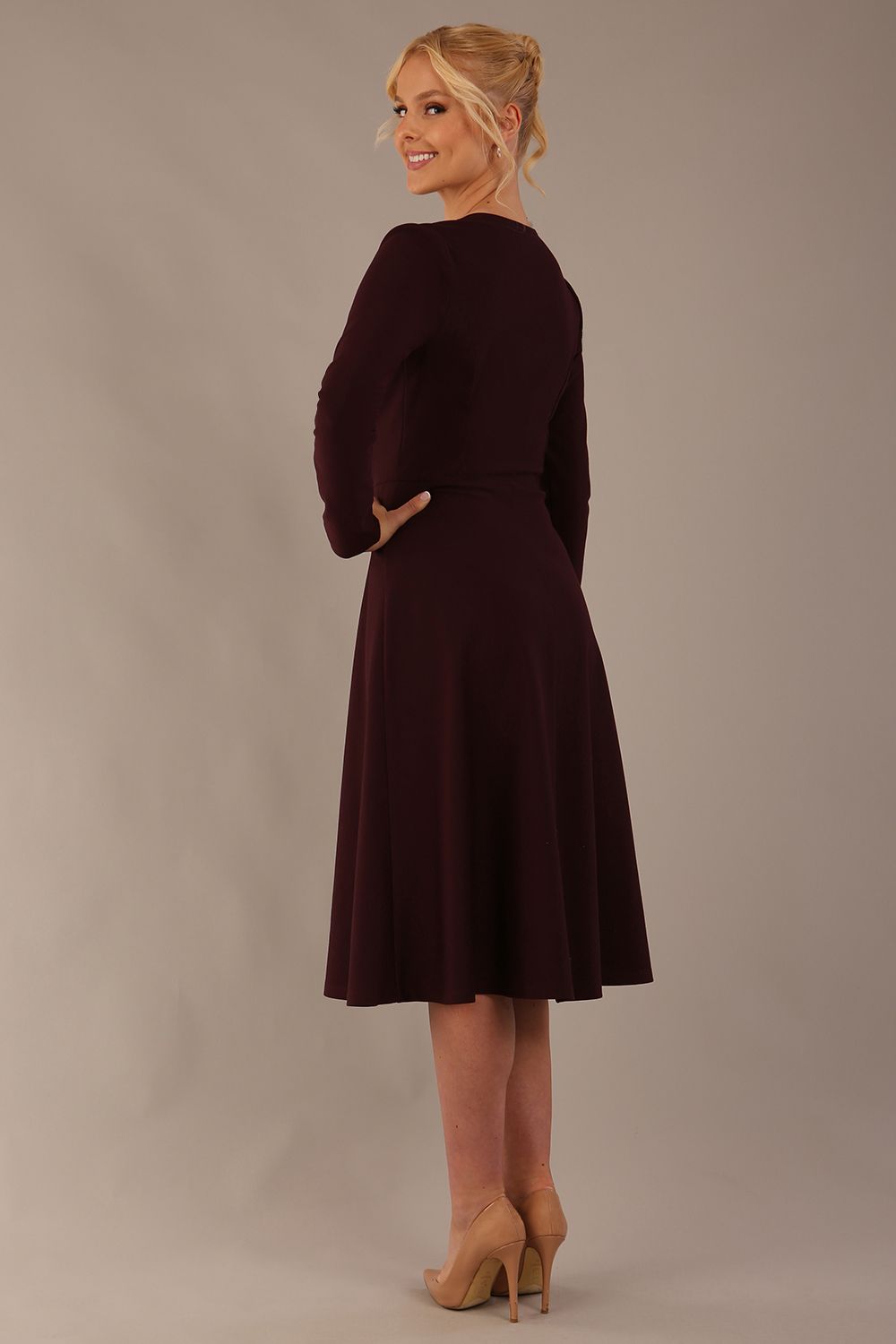 Side profile of the Moneypenny dress, highlighting the fluid movement of the A-line skirt.