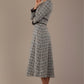 Model wearing the Hendricks check midi dress in misty grey with black lace cuffs and a V-neck (Misty Grey Check)