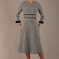 Model wearing the Hendricks check midi dress in misty grey with black lace cuffs and a V-neck.