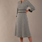 Model wearing the Hendricks check midi dress in misty grey with black lace cuffs and a V-neck (Misty Grey Check)