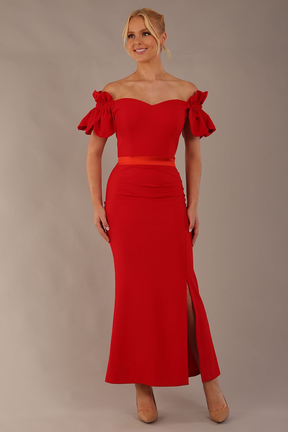 Model wearing the Harmony red Bardot ruffle maxi dress, showing the off-the-shoulder sleeves and high side split (Passion Red & Fire Orange Satin)