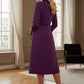 Back view of the Sybil dress in imperial purple, showing the elegant high back with its split satin collar detail. (Imperial Purple)
