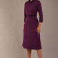 Model wearing the Sybil A-line midi dress in imperial purple with a satin cowl neck and waistband. (Imperial Purple)